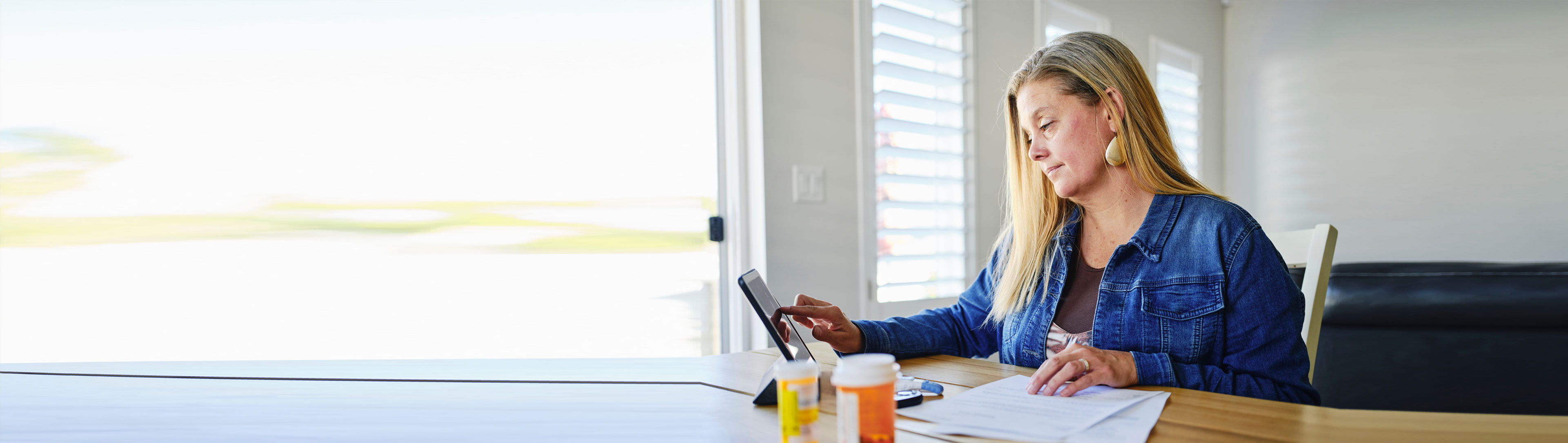 A women accessing her tablet