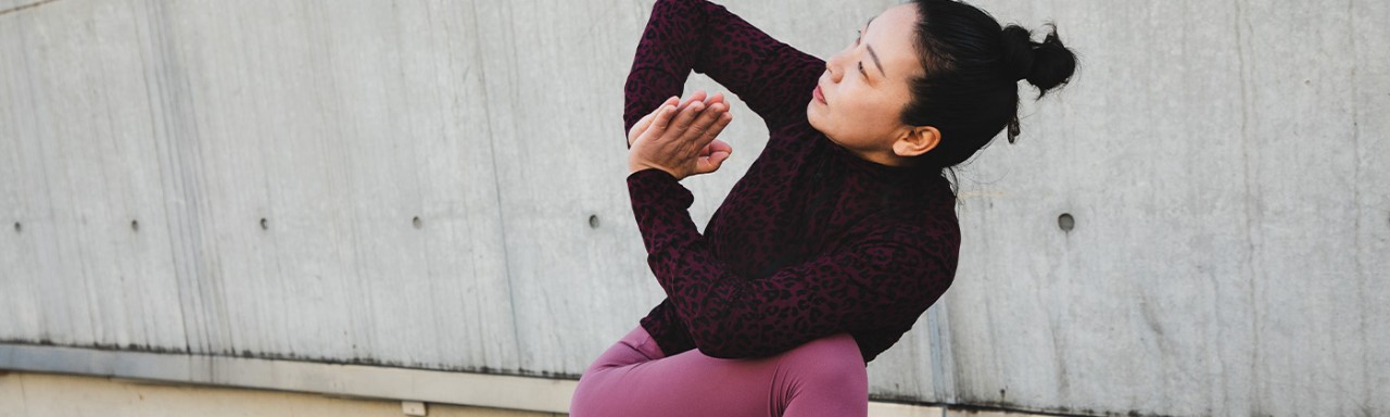 Girl sitting in a yoga posture